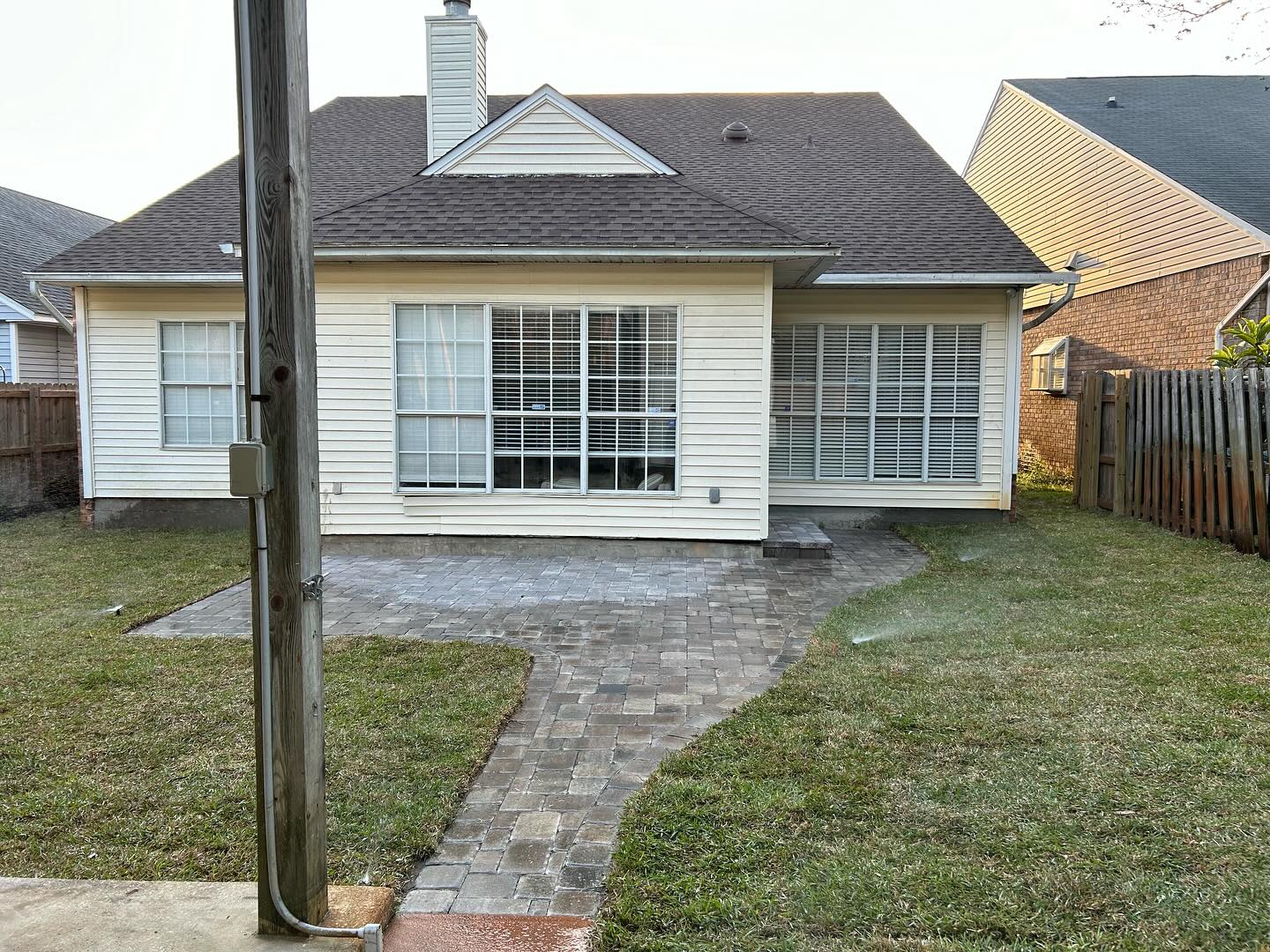 Sprinkler system watering a newly sodded lawn