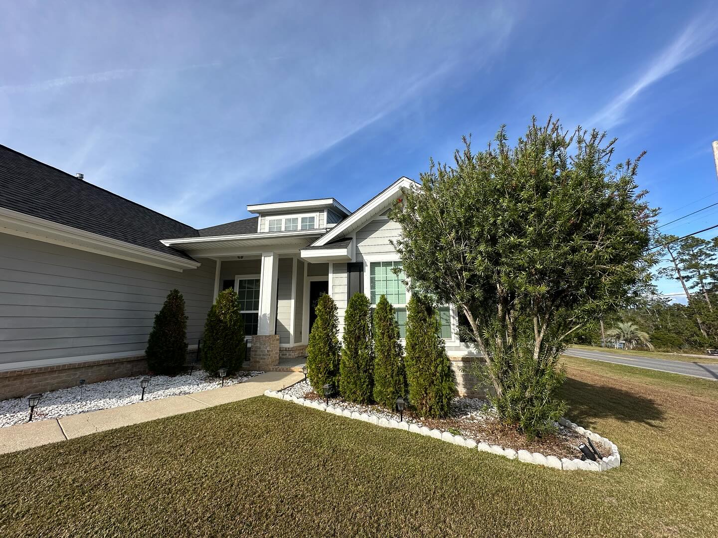 Fresh landscape plantings along the front of a home